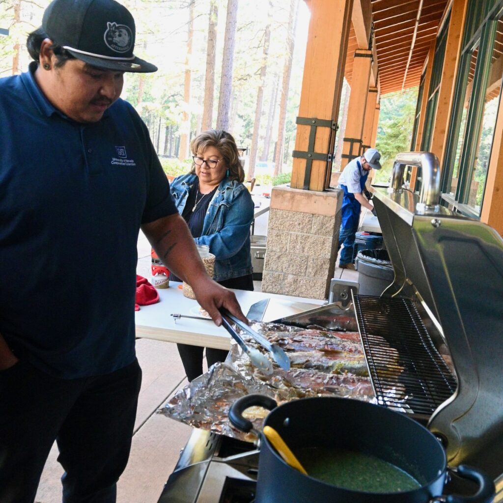 man grilling fish