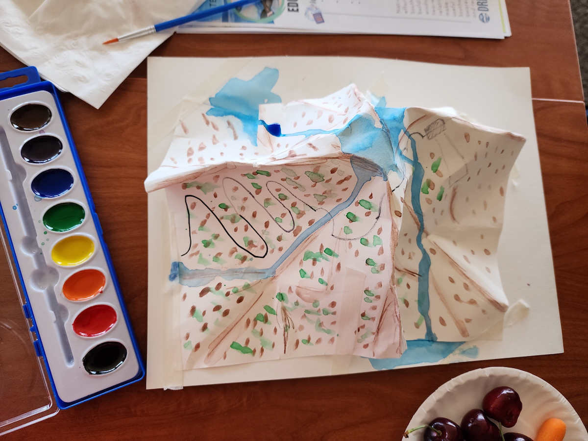 Paper model of watershed and watercolor paints